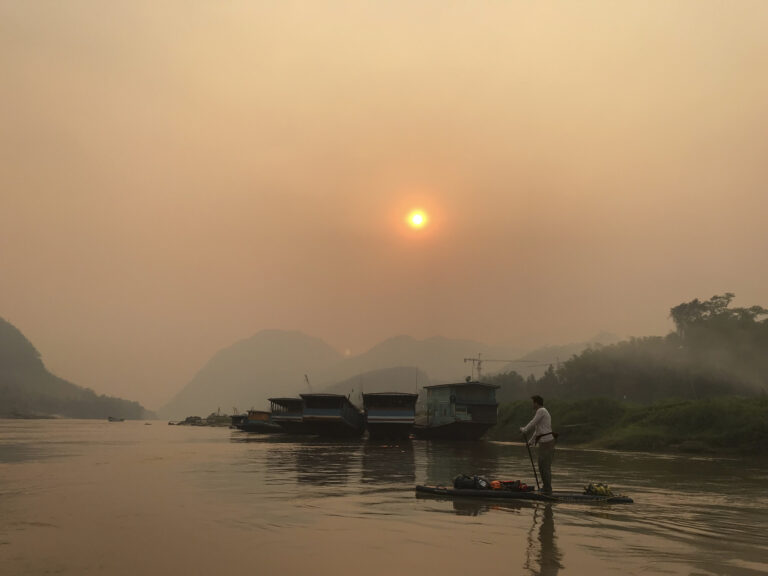 Hazy sunset while the farmers burn their fields.